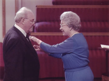 Desmond C. Henley and Her Majesty at Buckingham Palace