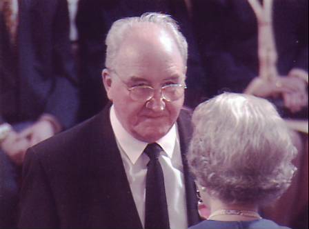 Desmond C. Henley and Her Majesty at Buckingham Palace